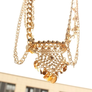 Detail of bohemian gold multi-layer waist chain with hollow geometric sequins