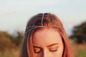 Bohemian silver beaded multi-layer chain headband hair accessory worn by a model