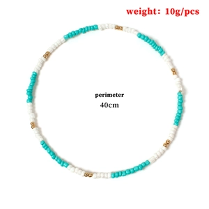 Detail view of handmade beaded necklace with turquoise and gold beads, 40cm length