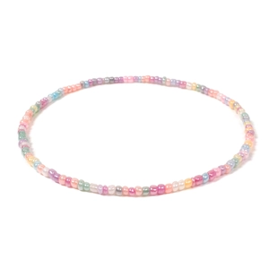Macro detail of handmade colorful macaron seed beads on a minimalist choker necklace