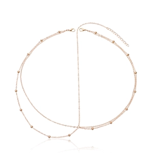 Detail of rose gold beaded chain body jewelry with lobster clasp and extension