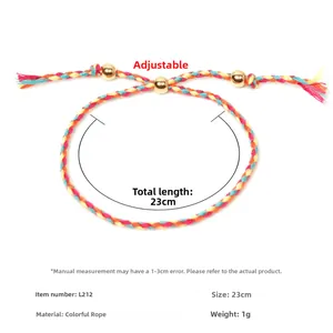 Detail of adjustable woven cord bracelet with three gold beads and 23cm length measurement
