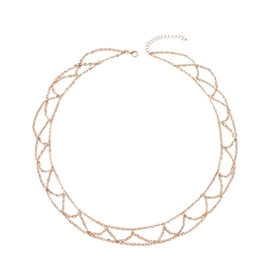 Detailed close-up of multi-layer gold chain necklace with lobster clasp and adjustable link
