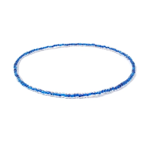 Macro shot of minimalist colorful seed beads choker with deep cobalt blue core