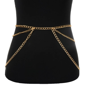 Punk layered gold metal body chain and waist jewelry for women on a black torso