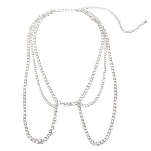 Detail of multi-layer punk metal body chain with adjustable silver links and clasps
