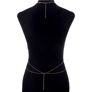 Detail of rose gold body chain with sequin pendant on mannequin showing back strap closure