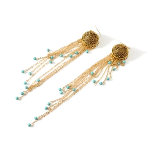 Bohemian gold tassel drop earrings with turquoise beads and intricate carved metalwork
