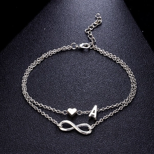 Cavigliera doppia in argento con ciondoli infinito cuore e lettera A da donna
