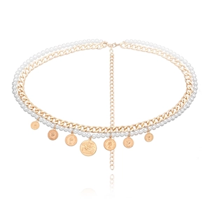 Detail of double-layer gold chain body belt with pearls and coin pendants for women
