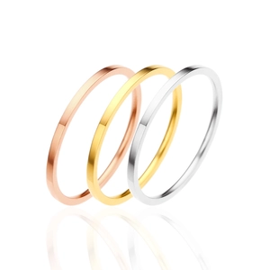 Three-piece minimalist stainless steel ring set in gold, rose gold, and silver finishes