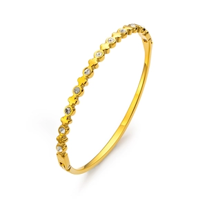 Bracelet luxueux en acier inoxydable doré avec motifs trèfles et pierres zircons