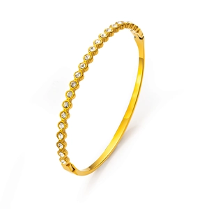 Bracelet fin en acier inoxydable doré orné de zircons blancs brillants pour femme