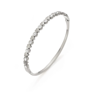 Detail of silver heart-shaped metal pieces and round cubic zirconia stones on the bracelet