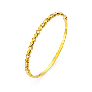 Bracelet jonc élégant en acier inoxydable doré avec incrustation de zircone cubique