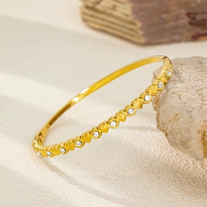18K gold plated stainless steel hinge bangle with heart patterns and round zircons