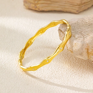 Detail of 18K gold-plated bamboo joint bangle with sparkling small zircon settings