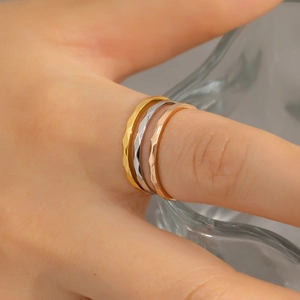 Three-piece diamond-cut stainless steel rings in gold, silver, and rose gold finishes