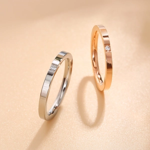 Polished stainless steel rings in silver and rose gold with square-set crystal diamond