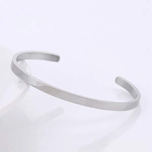 Detailed view of adjustable minimalist silver stainless steel C-shaped cuff bangle