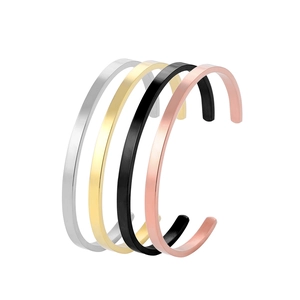 Polished C-shape stainless steel open bracelets in gold, silver, black, and rose gold finishes