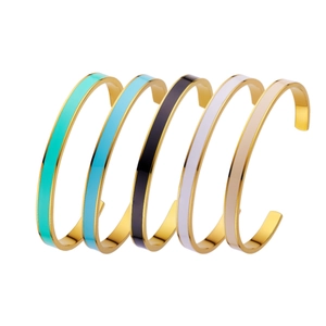 Set of five minimalist gold-plated stainless steel open bangles with colorful enamel inlay