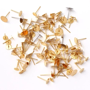 Macro shot of gold-plated stainless steel flat pad earring posts for DIY jewelry