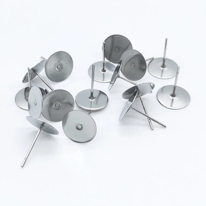 Close-up of bulk silver 316 stainless steel flat head earring posts for DIY jewelry