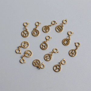 Set of 12 gold plated stainless steel zodiac pendants with lobster clasps and hollow charms