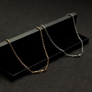 Detail of gold and silver stainless steel rope chains with secure lobster clasps