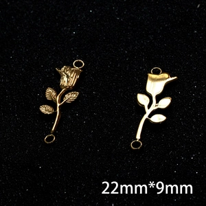 Macro shot of 18K gold rose pendant charm with star engraving for DIY jewelry