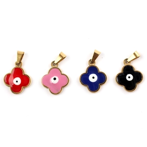 Detailed view of four-leaf clover charms with evil eye motifs in colorful enamel finishes