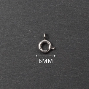 Detailed macro view of 6mm stainless steel spring ring clasp for jewelry making