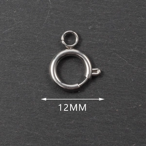 Macro shot of 12mm stainless steel spring clasp DIY jewelry component on grey stone texture