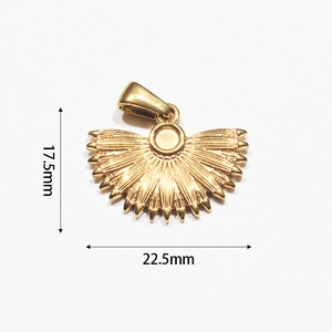 Detail view of gold-plated fan-shaped pendant with vertical texture, 17.5mm by 22.5mm size