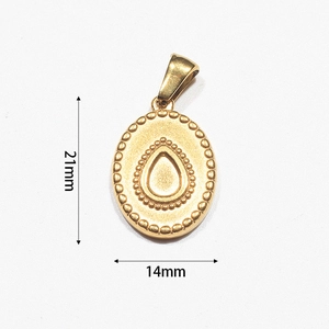 Macro view of 18k gold plated oval pendant measuring 21mm by 14mm with beaded edge