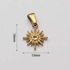 Detailed macro view of 16x13mm gold starburst pendant with fine ray lines and ring
