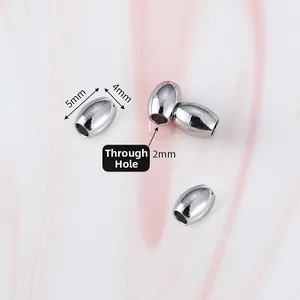Macro shot of 5x4mm oval stainless steel beads with 2mm through holes for DIY jewelry