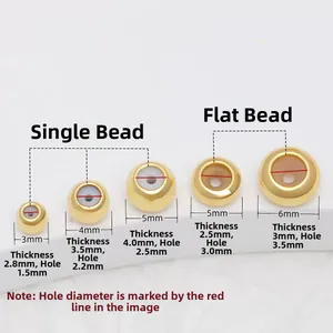 Detailed view of golden stainless steel slider beads with inner rubber for DIY jewelry
