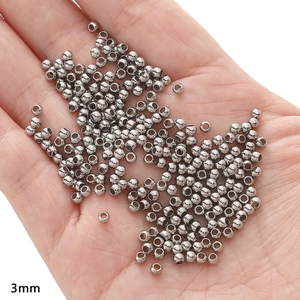 Macro shot of 3mm silver stainless steel spacer beads for DIY jewelry making