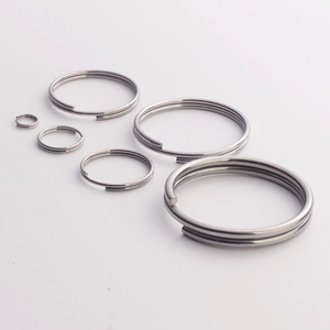 Polished 304 stainless steel double loop key rings in six different sizes on grey