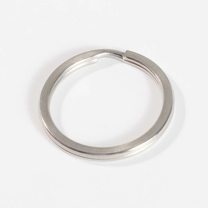 Detailed close-up of a silver flat split key ring showing durable stainless steel texture