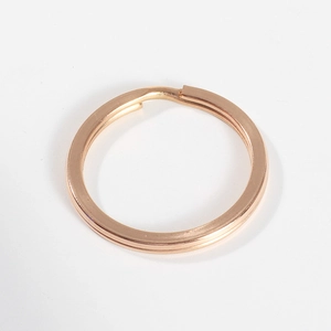 Macro detail of flat rose gold 304 stainless steel key ring with polished finish