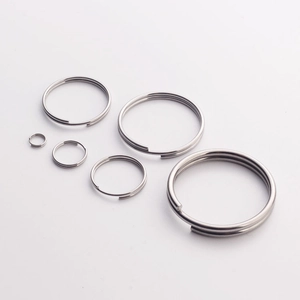 Polished stainless steel split key rings in various sizes on a clean white background