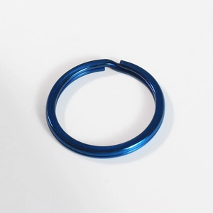 Detail view of blue electroplated 304 stainless steel flat split ring keychain connector