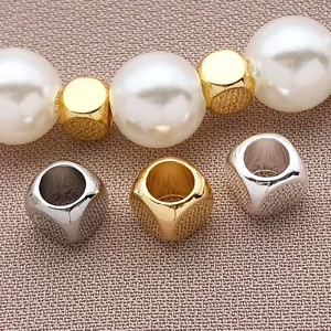 Vue détaillée de perles d'espacement en acier inoxydable doré et argenté pour bijoux DIY