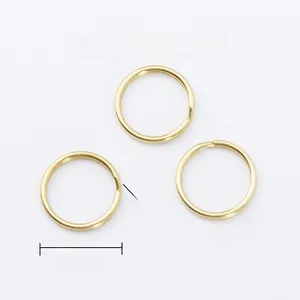 Detailed macro view of 28mm polished copper key rings with 1.8mm flat wire thickness