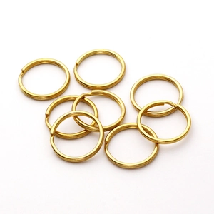 Close-up of golden brass flat key rings for DIY jewelry and keychain accessories