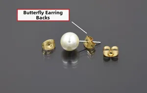 Detailed view of white pearl studs with stainless steel golden butterfly earring backs