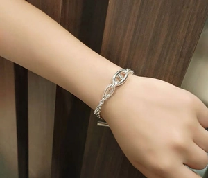 Detailed view of silver stainless steel pig nose anchor link bracelet on a wrist